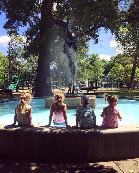 children sitting by the fountain in the gardiner common.jpg